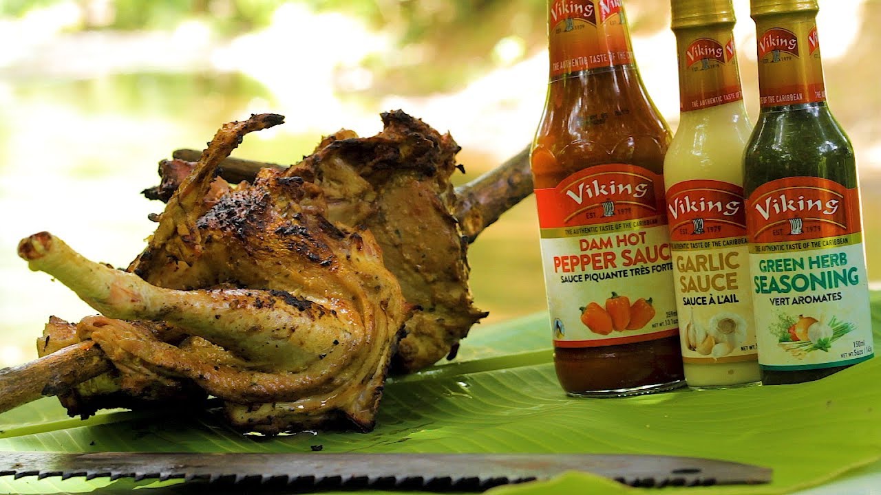 BBQ Caribbean spiced Chicken hanging from a mango tree tree